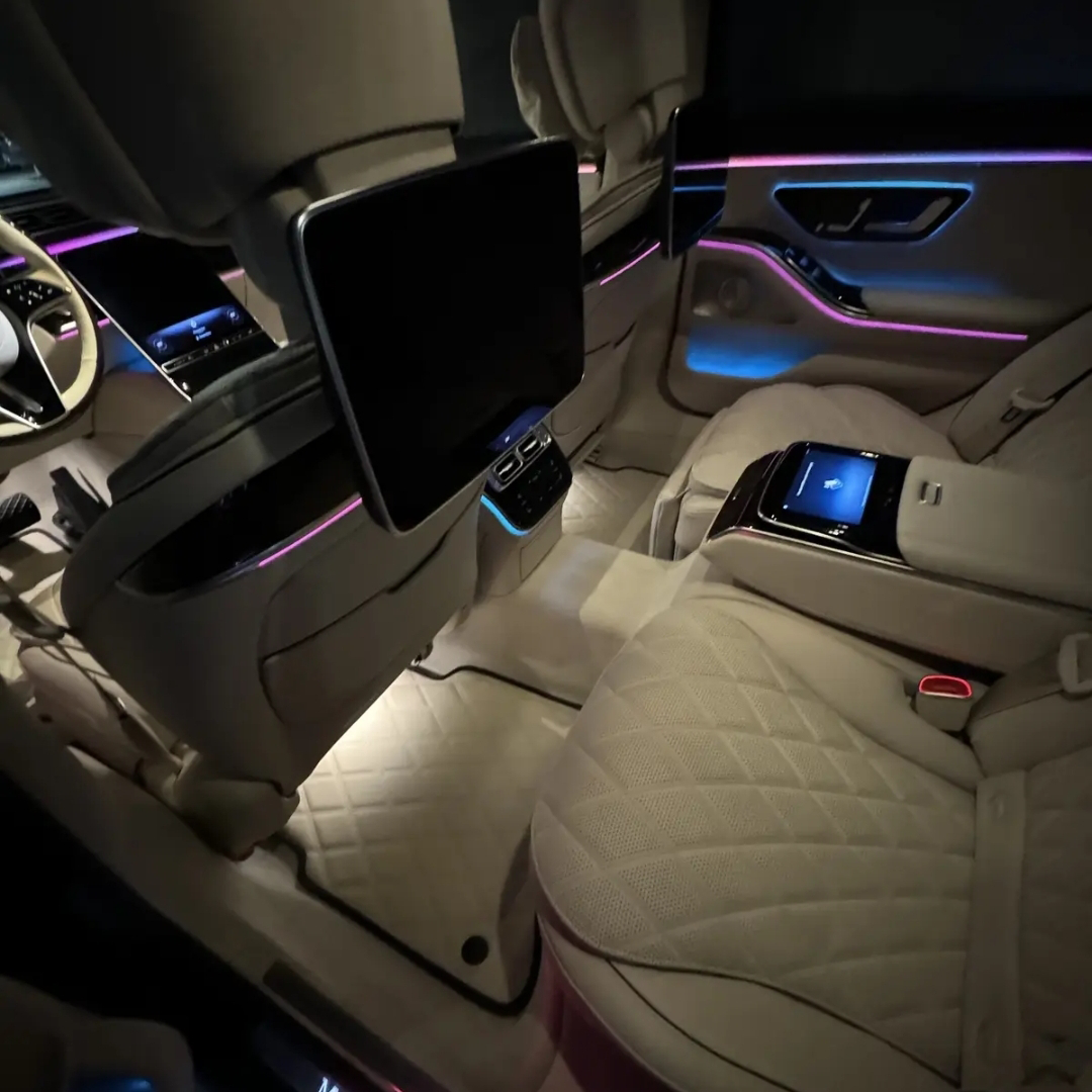 Sheepskin floor mats fitted in a luxury car interior